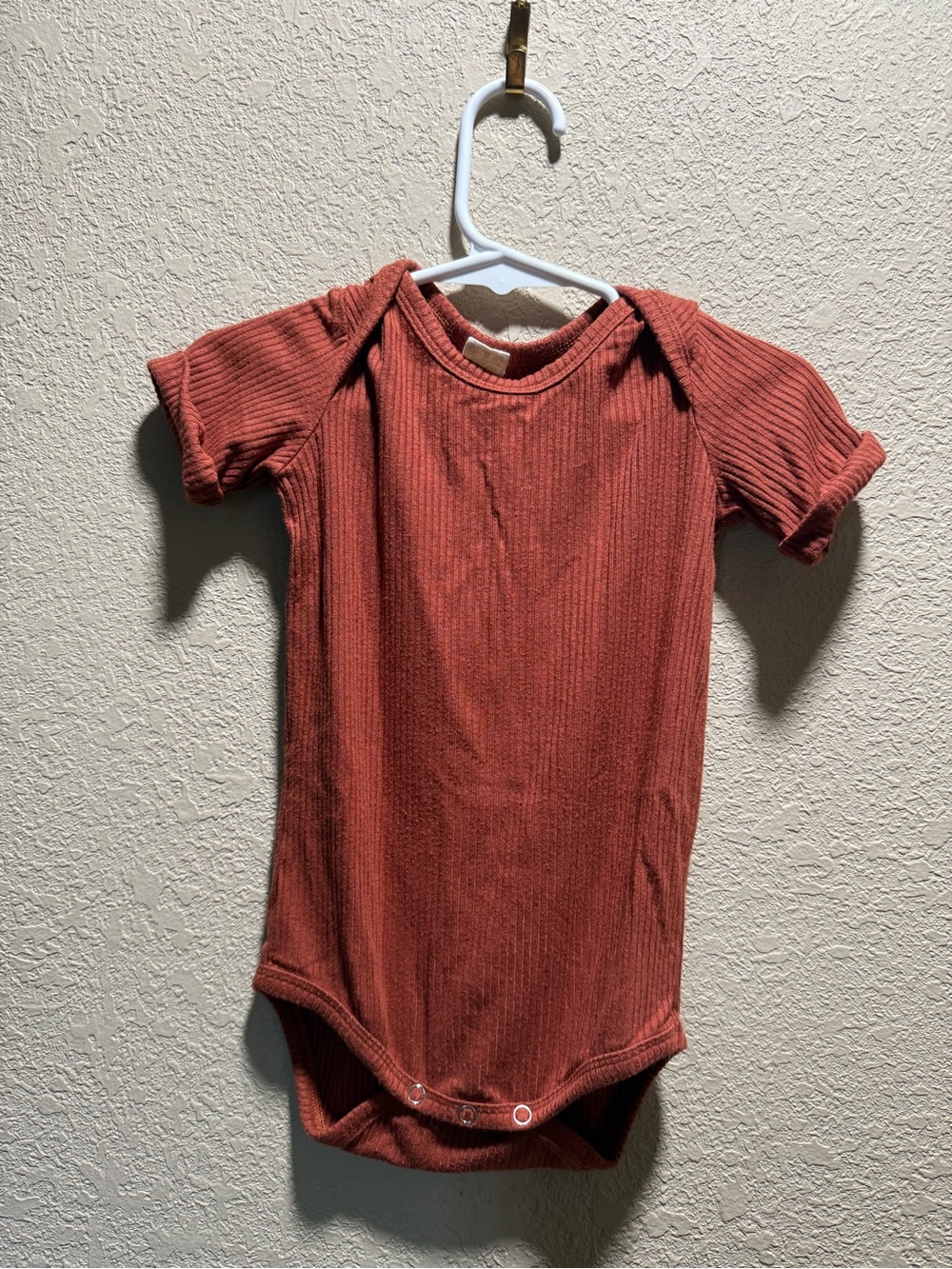 Kate Quinn Ribbed Short-Sleeve One-Piece in Rust